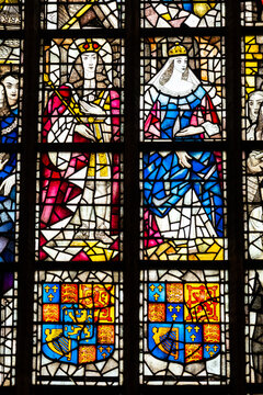 Close-up on stained-glass decoration showing medieval dutch king and queen