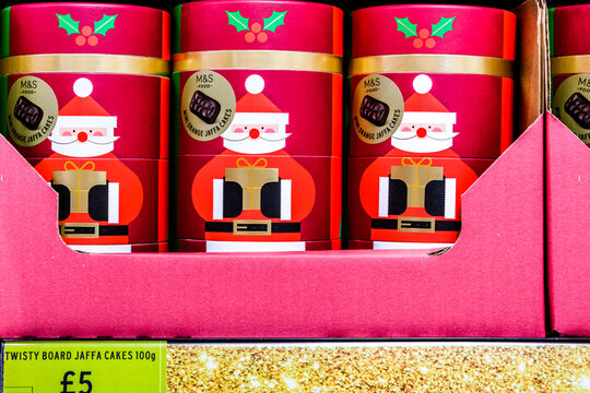 Close-Up Of Marks And Spencer Mini Orange Jaffa Cakes In Festive Santa Tins With A Price Tag