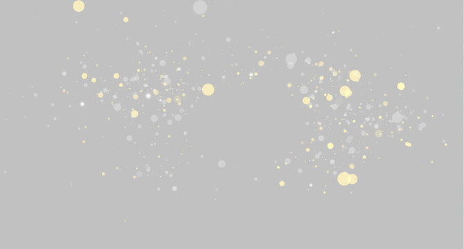 A glowing cluster of gold and silver bokeh lights floats on a black background. The lights vary in size and softly overlap in a scattered, twinkling pattern.
