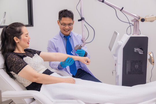 Laser Machine.Young woman receiving laser treatment.Skin Care.Young Woman Receiving Facial Beauty Treatment, Removing Pigmentation At Cosmetic Clinic.IPL. Photo Facial Therapy.Anti-aging Procedures.