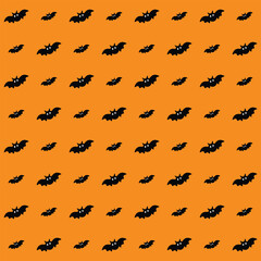 Fototapeta premium Seamless Halloween pattern featuring black bats on a vibrant orange background for spooky designs