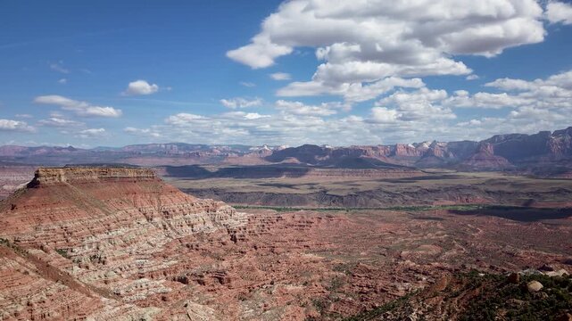 Aerial hyperlapse views capture the landscape of Zion National Park from Gooseberry Mesa in Utah with mountains and shifting clouds.