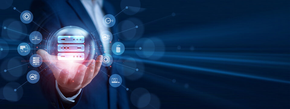 Systems administrator holding the hand glowing server rack icon. Professional analyzing network performance data and economic growth graph chart on hologram screen. Cloud hosting setup.