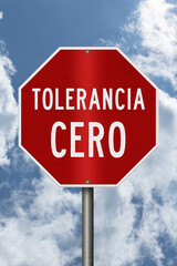 Red Zero Tolerance sign Tolerancia Cero in Spanish with sky © Karen Roach