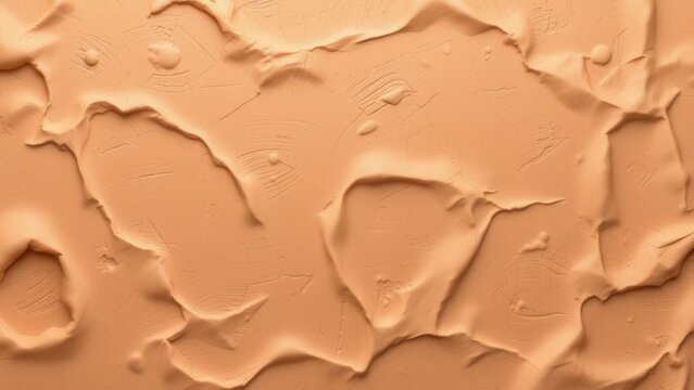Beige liquid foundation or cosmetic cream smudged texture