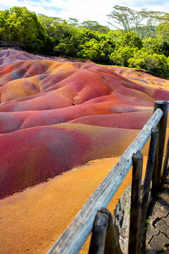 Chamarel Seven Colored Earth Geopark in Mauritius Island. Colorful panoramic landscape about this volcanic geological formation Chamarel Seven Colored Earth Geopark in Riviere noire district.
