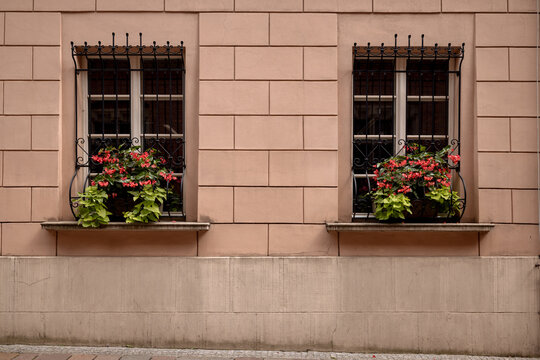 Krakow, Poland - July 19, 2026: Flower boxes decorate barred windows on a Jagiellonian University building in Krakow Old Town.