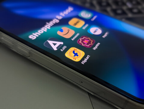Online shopping and ecommerce apps folder on smartphone screen close up stock photo