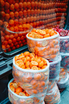 plastic bags filled with squeezed orange halves