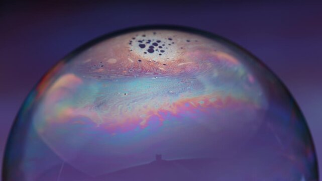 Macro Footage of a Colorful Bubble with Bright Swirling Patterns in Super Slow Motion at 1000 fps