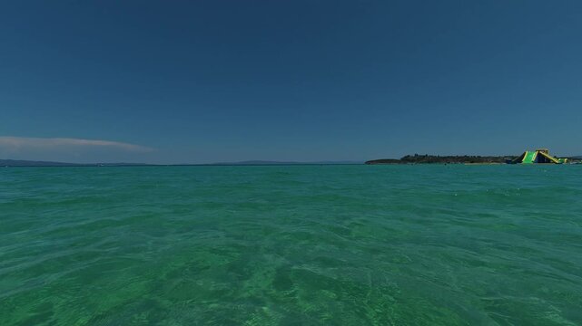Clear water glows softly beneath surface. Trani Ammouda, Greece