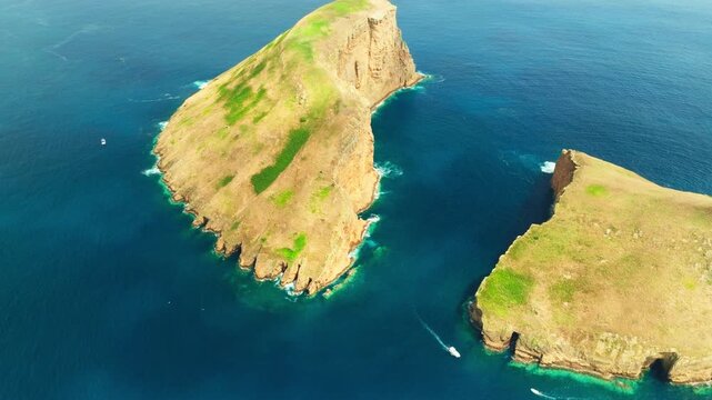 Cabras Islets, Ship and Atlantic Ocean on Sunny Day. Terceira Island, Azores, Portugal. Aerial View. Moving Backwards, Tilt Up