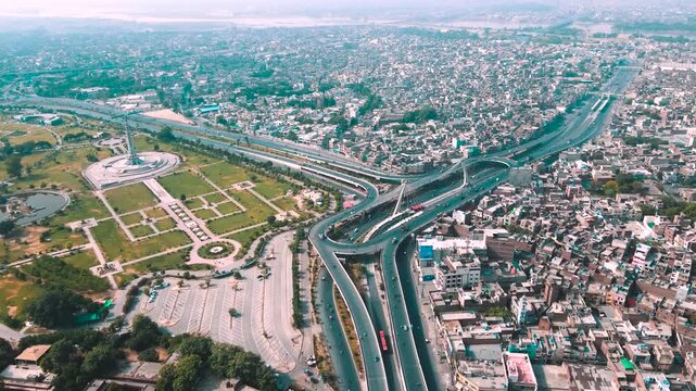 Aerial drone view of Minar-e-Pakistan and the modern Azadi Flyover interchange