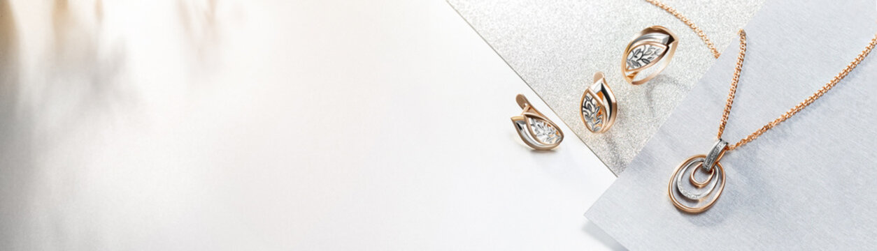 Elegant jewelry set. Jewellery set with gemstones. Product still life concept. Ring, necklace and earrings.