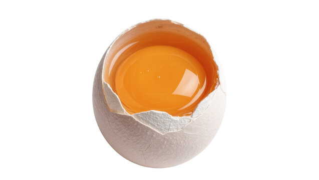 Cracked white eggshell with bright yellow yolk, isolated on transparent background