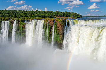 Powerful Cascades of Iguassu National Park: Lush Rainforest Vegetation and the Iconic Devil's Throat on a Sunny Day © Yuliko