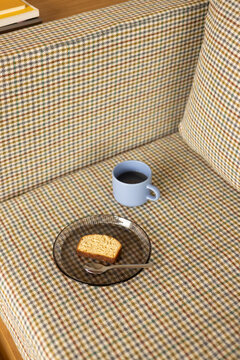 Pound Cake on Glass Plate and Blue Mug on Houndstooth Daybed