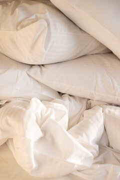 Stack of Fluffy White Pillows with Soft Morning Sunlight