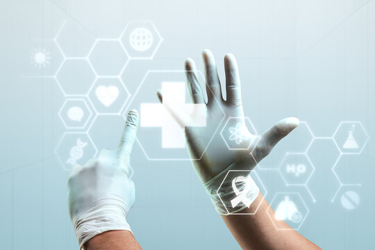 Gloved hands interacting with digital medical icons, featuring a cross