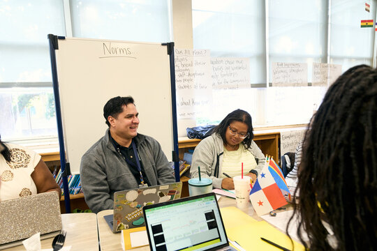 Teachers collaborating in a professional development workshop