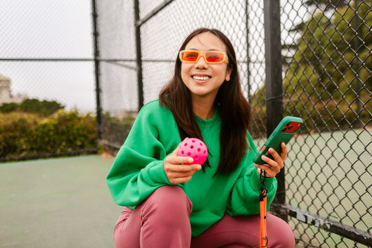 Smiling Pickle ball Phone Chat