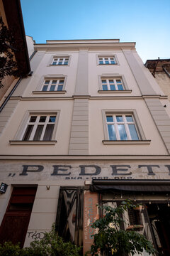 Krakow, Poland - July 17, 2026: Diners fill the plant-lined outdoor terrace at Pedete restaurant in Krakow Old Town.