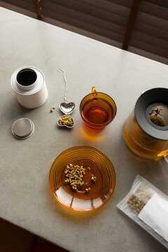 Minimalist Chamomile Herbal Tea Brewing Setup on Concrete Countertop