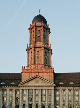 Berlin Rotes Rathaus tower at sunset against blue sky
