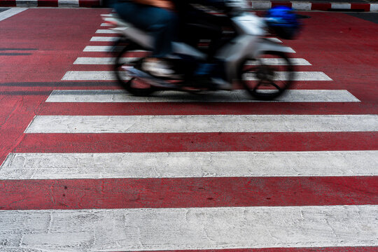 Motorbike Crossing Red Crosswalk