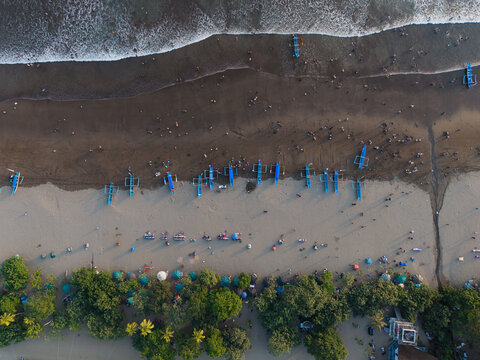 Traditional Outrigger Boats Lined Up on Tropical Beach