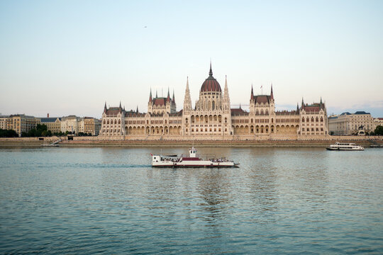 Hungarian Parliament and Boat on Danube River