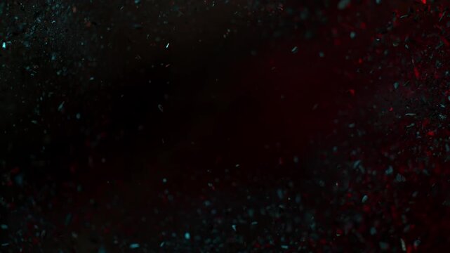 Super Slow Motion of Flying Crushed Charcoal Pieces with Cinematic Lighting at 1000 fps.