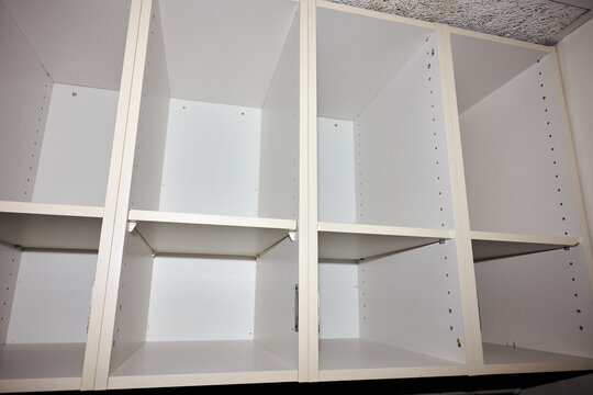 Low quality white wardrobe in a budget hotel.