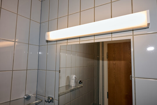 Close-up of the bathroom mirror in a budget hotel.