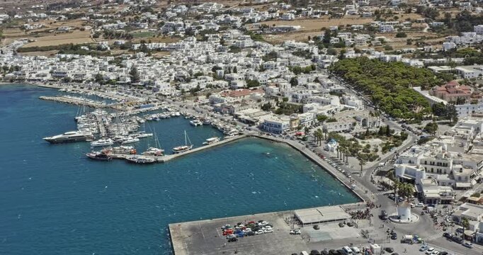 Parikia Paros Greece Aerial v1 panoramic birds eye view capturing a large passenger ferry and greek urban downtown cityscape and beautiful landscape - September 2021