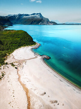 Aerial view empty sandy beach and turquoise sea coast landscape in northern Norway, travel offbeat beautiful destinations idyllic scenery scandinavian wild nature summer season