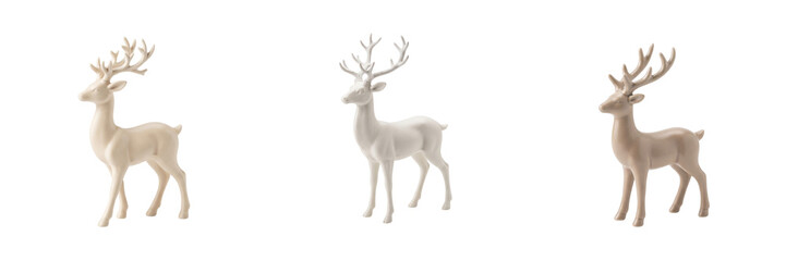 Obraz premium Three white ceramic reindeer figurines with antlers isolated on a transparent background