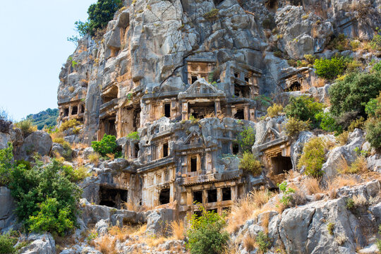 Mira, Turkey - August 10, 2026: Lycian rock-cut tombs carved into cliffs of Myra, showcasing ancient architecture and natural landscape in Turkey's historical region