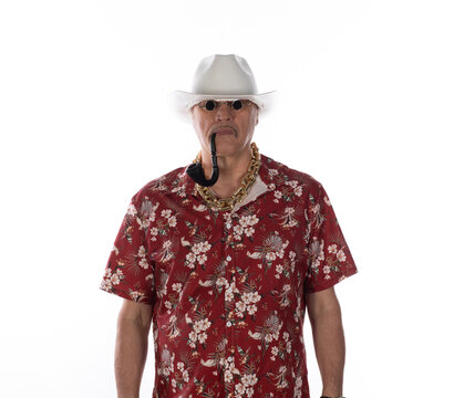 Portrait of an old cowboy in a Hawaiian shirt