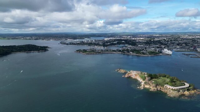 Plymouth, Devon, England: DRONE VIEWS: Plymouth Sound; Drake's Island; River Tamar; Devonport dockyard; City of Plymouth; Passenger ferry moored near Millbay pier. Plymouth is a busy UK port.