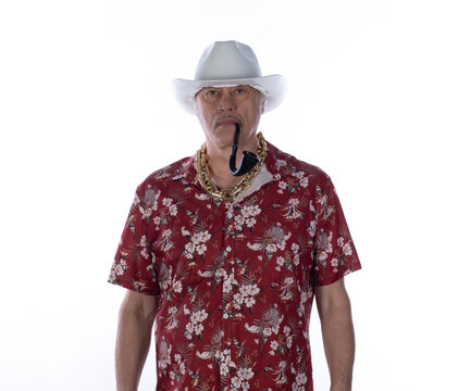 Portrait of an old cowboy in a Hawaiian shirt
