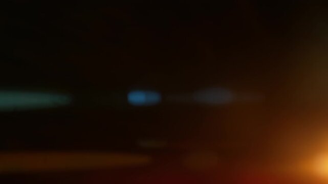 Real Shooted Anamorphic Lens Flare on Black Background in Super Slow Motion.