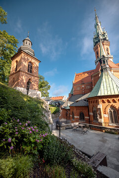 Krakow, Poland - July 18, 2026: Low-angle side view of the red-brick Neo-Gothic St. Joseph&rsquo;s Church in Podgorze.