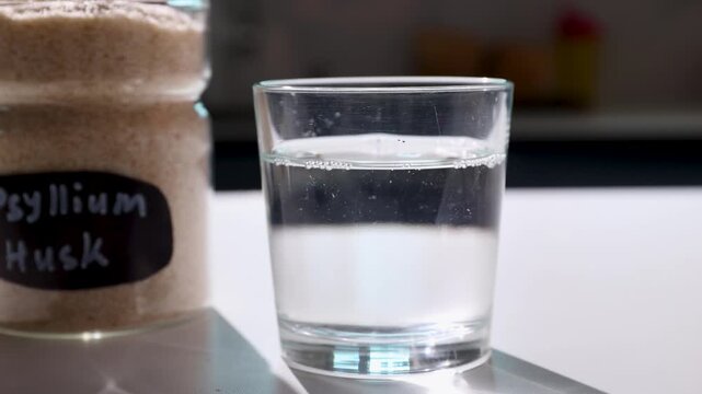 Textured psyllium husk in water forms a gel highlighting soluble fiber and gut health