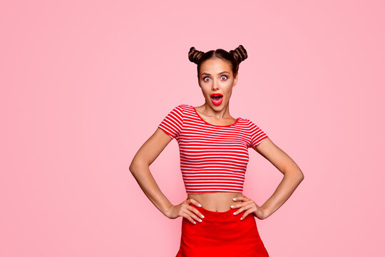Shocked news and great sales! Portrait of young impressed funky girl isolated on red background with copy space for text. Amazing woman stand putt hands on the waist. Joy fun concept