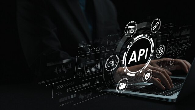 Professional Hands Typing on Laptop with Digital API Graphics and Data Analytics Elements Against Dark Background. Entropy.