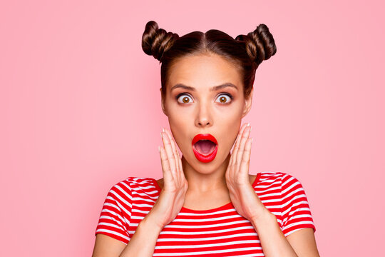 Say what? Close up portrait of  shocked brunette girl with wide open mouth and big eyes hold palms near face isolated on red vivid background