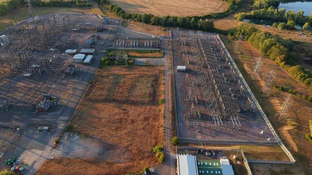 Aerial view of a major 400kV electrical transmission substation and transformer yard in Northamptonshire, UK