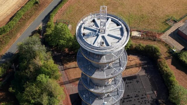 Close-up aerial view of radio communications transmitter tower and antenna arrays near Peterborough, UK
