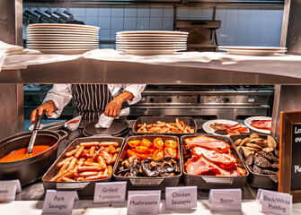 Obraz premium Full Irish Breakfast Buffet Selection Served by Chef in Dublin